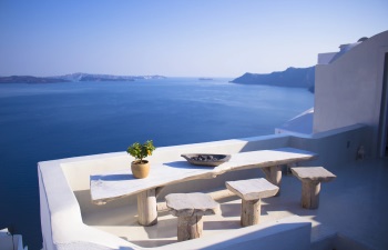 Balcony with table and sea view